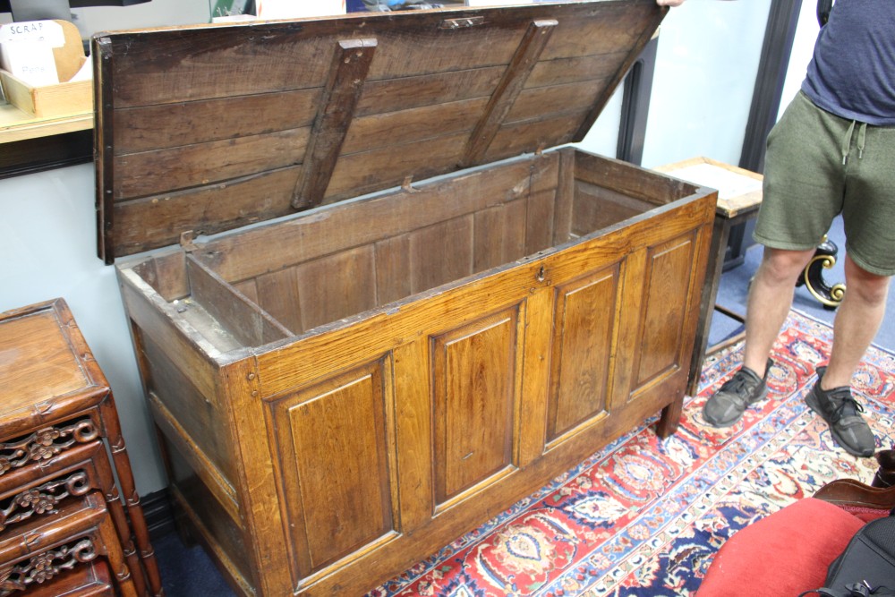 An 18th century oak panelled coffer, W.140cm D.53cm H.78cm